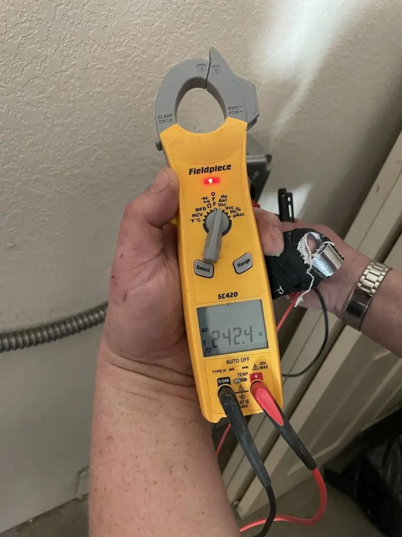 Voltage testing with clamp meter during Outlet Installation in Nevada City